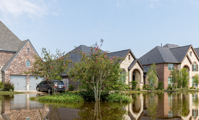 Three houses with flooding in the streets