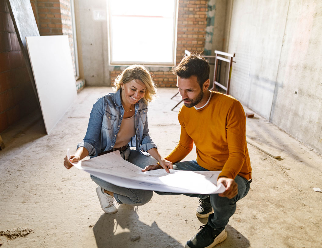Couple looking over house plans