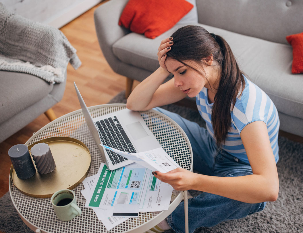 Female with laptop paying bills online