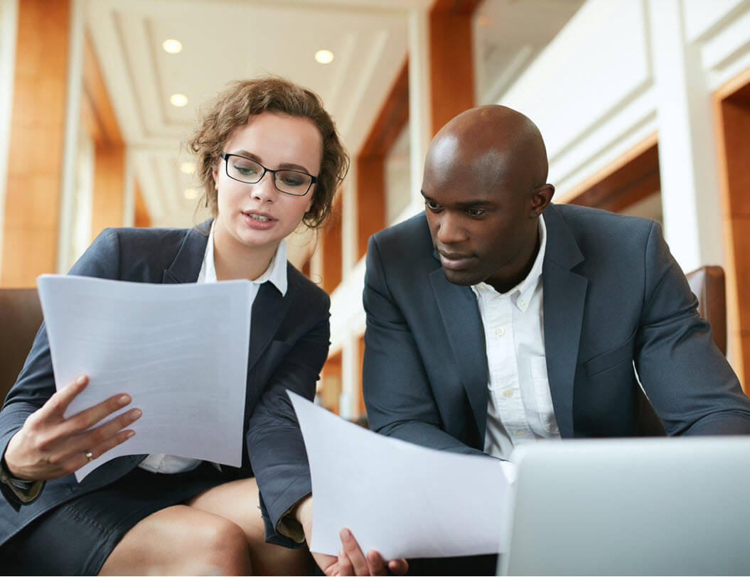 Man and woman discussing business finances