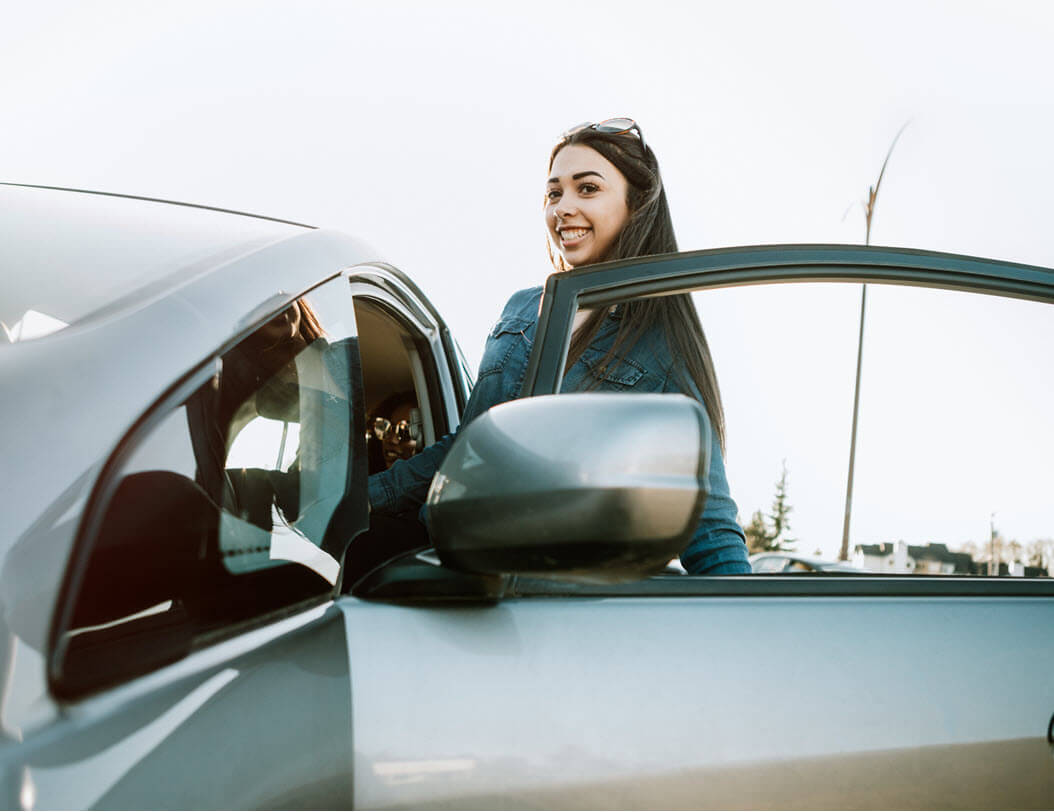 Girl getting in car