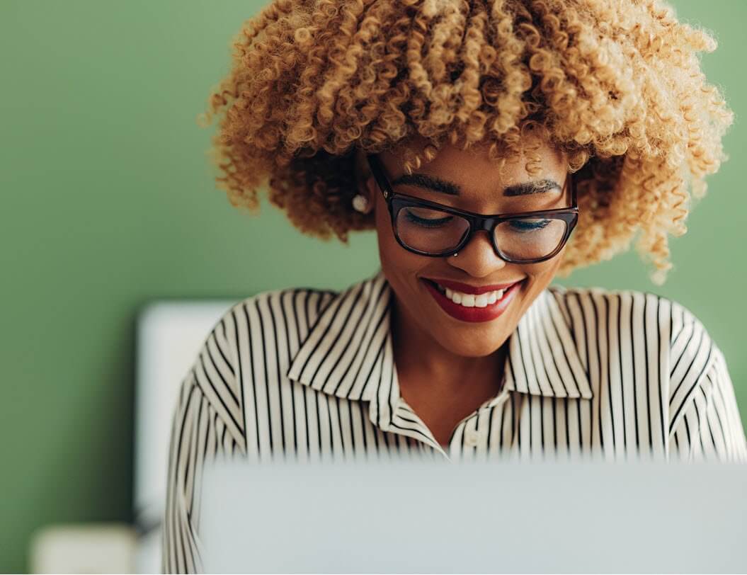 smiling woman on laptop